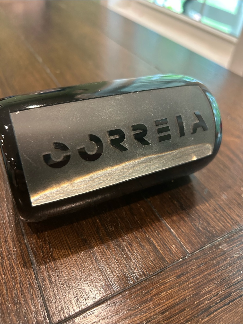 Correia art glass paperweight features an etched signature black, cylindrical.
